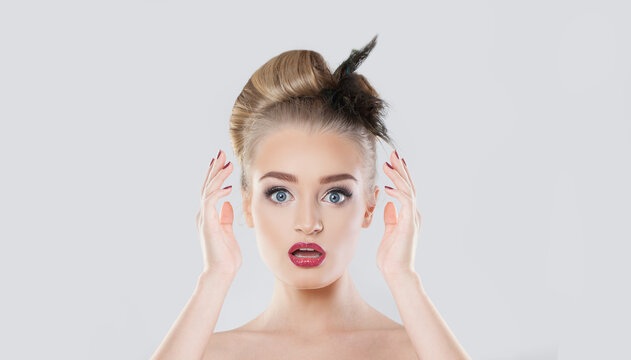 Cute surprised woman on white background