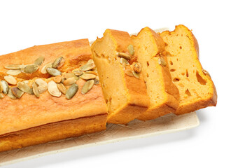 Plate with cut pumpkin pie on white background, closeup