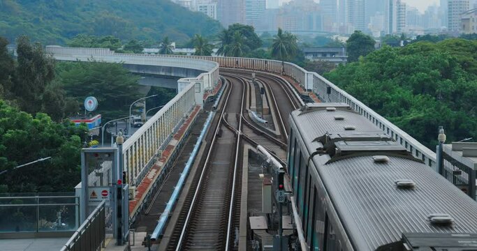 Kaohsiung, Taiwan-01.07.2022: The Kaohsiung MRT train climbs the ramp and enters the station