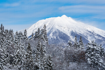 A big mountain covered with white snow in winter, Mt. Iwaki in Aomori Prefecture in Japan, Nature...
