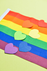 Colorful hearts with LGBT flag on color background