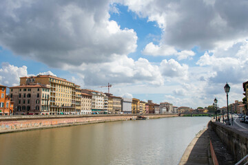 Fototapeta premium Pisa, Italy, September 2015, embankment of the Arno river in Pisa with colorful houses