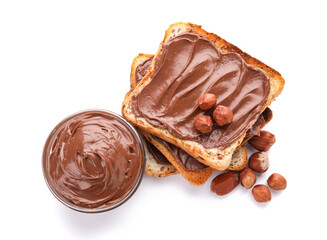 Bread with chocolate paste and hazelnuts on white background