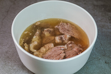 Galbitang, Korean style beef Short Rib Soup : Beef ribs, soaked in cold water to remove the blood, and white radish chunks simmered together until tender. The clear stock is rich and savory, and the t