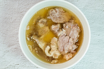 Galbitang, Korean style beef Short Rib Soup : Beef ribs, soaked in cold water to remove the blood, and white radish chunks simmered together until tender. The clear stock is rich and savory, and the t
