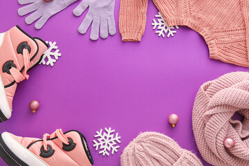 Frame made of winter clothes, shoes and Christmas decor on color background