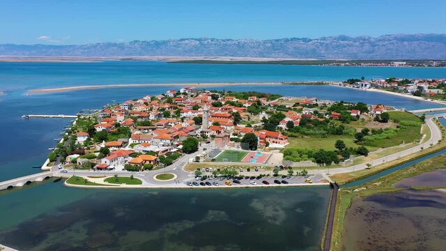 Historic town of Nin laguna aerial view with Velebit mountain background, Dalmatia region of Croatia. Aerial view of the famous Nin lagoon and medieval in Croatia