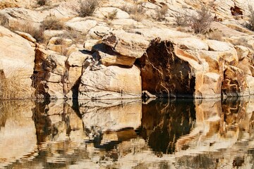 Yellow sandstone caves river
