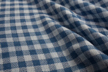 Close up of texture of hand woven plaid shawl, Thai cotton indigo dyed