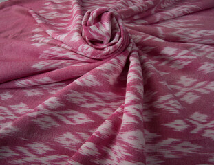 Close up of texture of pink color hand woven cotton fabric, Thai cotton detail textured textile.
