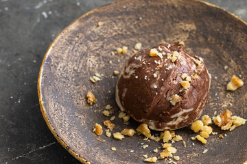 Chocolate vanilla ice cream ball on the white plate .Close up of texture