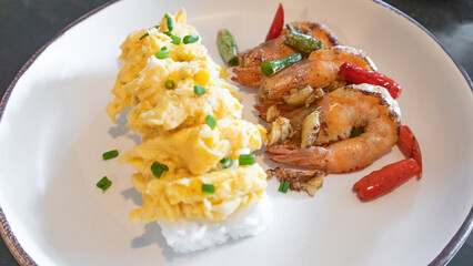 Stir fried crispy shrimp with chilies salt garlic with rice and scrambled eggs.