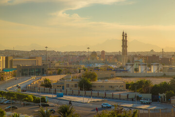the streets of the city of Hurghada, located on the shores of the Red Sea, are illuminated by the last rays of the setting sun