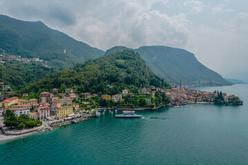 Fototapeta na wymiar Aerial view of Varenna village. Varenna is a picturesque and traditional village on a cloudy day, located on the eastern shore of Lake Como, Italy