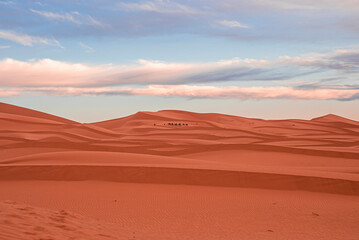 Beautiful view of sand dunes in sahara desert against cloudy sky, Sand dunes with waves pattern in desert