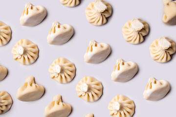 patern with khinkali on a light background. traditional Caucasian cuisine