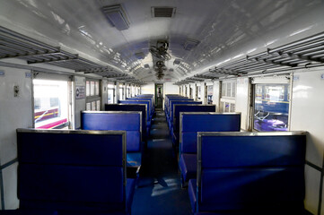 Fototapeta premium Closeup of Blue leather seats inside the train without people at Thailand, Selective focus with shallow depth of field.
