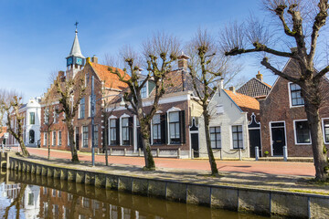 Historic town hall and old houses at the canal in Balk, Netherlands