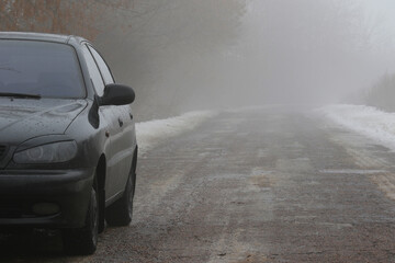Obraz na płótnie Canvas Forest fog winter car