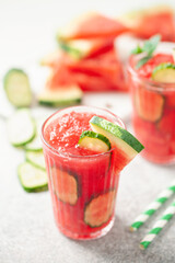 Refreshing cold summer drink watermelon slushie  with cucumber slices in glass