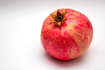 Fototapeta na wymiar Fresh pomegranate on a white background