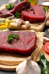 Concept of cooking with raw beef steaks, close up