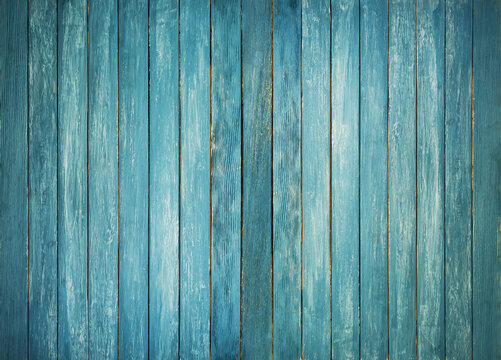 Texture of the old shabby gray blue wooden boards. The surface wood paneling pattern. Wooden fence.