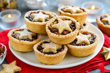 Traditional  fruit mince pies on a plate for Christmas. Shortcrust pastry pies stuffed with...