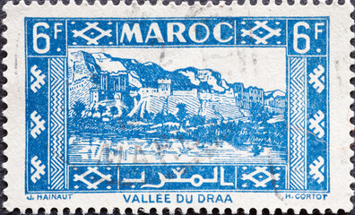 Morocco - circa 1946: A post stamp from the Morocco showing the Kasbah in Draa Valley.