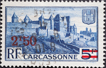 France - circa 1941: A postage stamp from France showing a town scape of the historic city of...