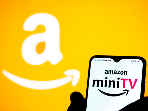 In this photo illustration Amazon Mini TV logo seen displayed on a smartphone