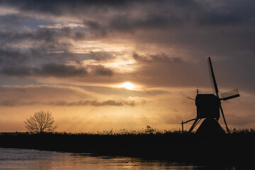 Windmills on a very cloudy day at Kinderdijk in The Netherlands.