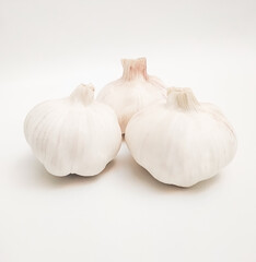 Obraz na płótnie Canvas Garlic bulbs (Allium sativum) on white background