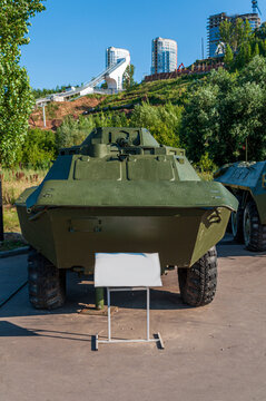 Combat reconnaissance landing vehicle. BRDM 2 in the Victory Park in Nizhny Novgorod, exhibited as an exhibit surrounded by green trees. High quality photo