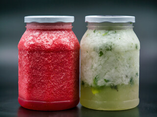 jars filled with raspberry and mojito cocktail, for home delivery