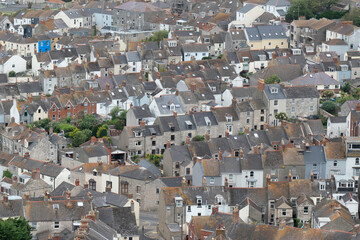 Aerial view of town near Weymouth, Dorset, England, UK, showing multiple houses crammed together.