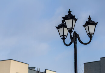 Fototapeta na wymiar Street lamp on blurred sky background