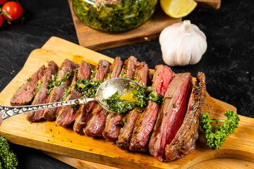 Spoon the chimichurri sauce over the steak.