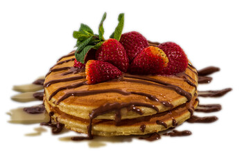 Tasty appetizing freshmade pancakes decorated with strawberry and chocolate . Closeup