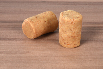 peanut dumpling, brazilian paçoca, isolated on wooden background.