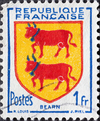France - circa 1951: A post stamp from France showing the symbol of the Provincial Arms- Bearn