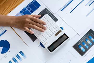 The company's finance manager is using a calculator, he uses a calculator to calculate the numbers in the company's financial documents that employees in the department create as meeting documents.