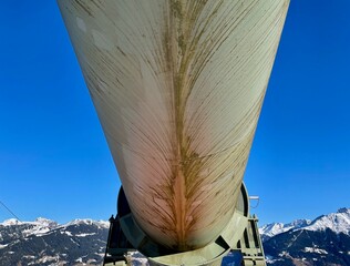 Low angle view of water pipeline in the mountains in winter.