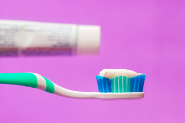 Applying toothpaste on a toothbrush. Dental care