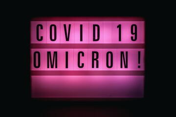 Sign with an inscription Covid 19 Omicron. Covid 19 Pandemic. Selective focus