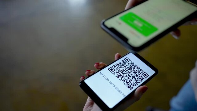 QR Code Scanner on the Smartphone close up. Checking the QR code of the vaccination certificate at the entrance to the building. QR Code Reader App. 