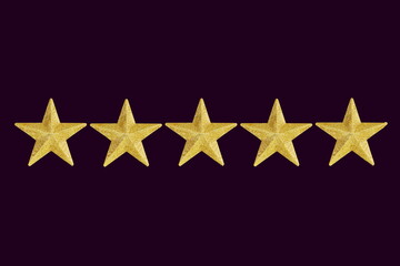 golden five star in night sky dark purple background