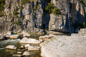 The beach and rocks of the Gorges de lArdeche in Europe, France, Ardeche, in summer, on a sunny day.