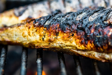 Grilled fish on charcoal grill. Fresh fish barbecue