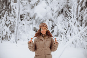 Portrait of a young girl in the winter forest